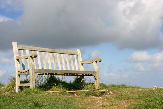 Bench on a hilltop, storm is coming, it's about to rain