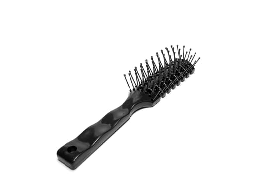 Black plastic comb isolated on white