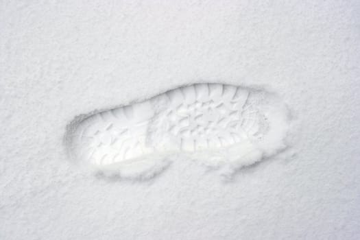 Footprint of boots in fresh white snow