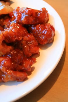 Close up of a sweet and sour chicken.