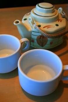 Close up of the teapot and two cups.