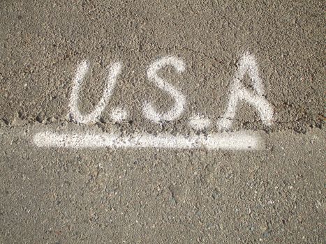 Close up of a USA sign on a wall.