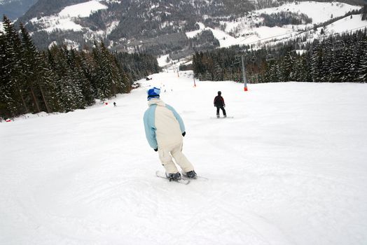 Skier sliding down the slope