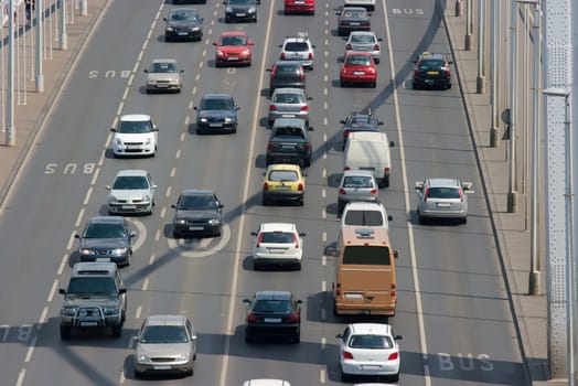 Heavy traffic on a main road over a bridge