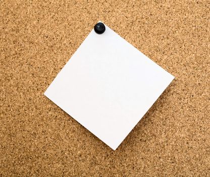 Stickers pinned to a brown cork board