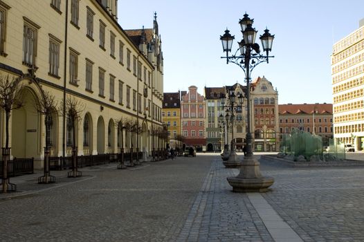 Poland, Wroclaw city market square. City center with colorful tenement houses and old style lanterns.