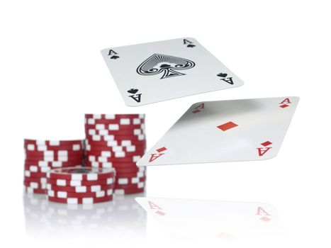 Two aces flying over a game table beside three piles of red chips. Isolated on white.