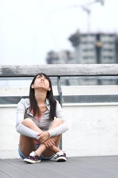 depressed girl looking to the sky