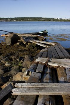 Boat on water at an old wooden mooring