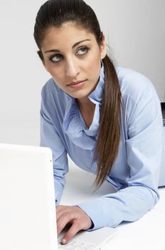 isolated young girl with laptop