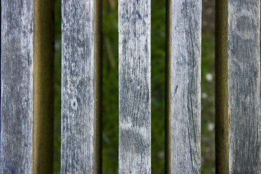 Photo of an old fence against a grass