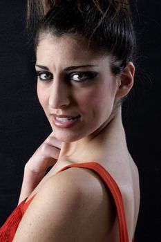 attractive young girl in red dress  looking at camera