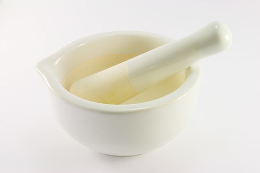 White stone mortar and pestle on a white background