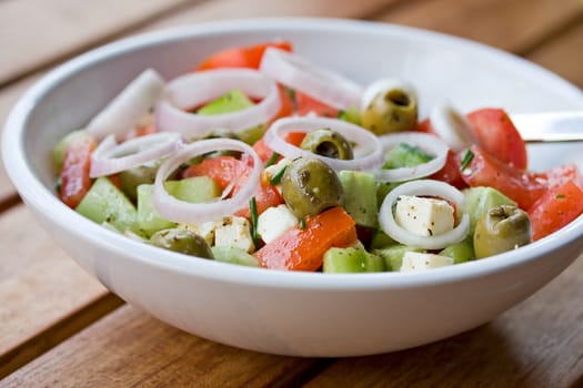 greek salad on a wooden table