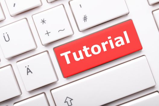tutorial or e learning concept with key on computer keyboard