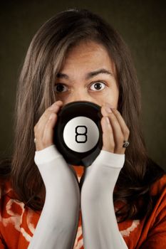 Man looking at the prediction on a magic toy ball