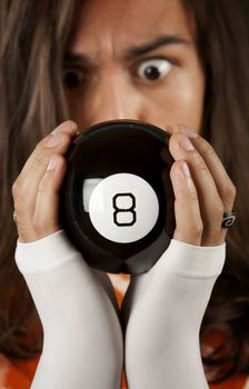 Man looking at the prediction on a magic toy ball