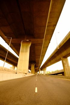 highway under the bridge with yellow toned