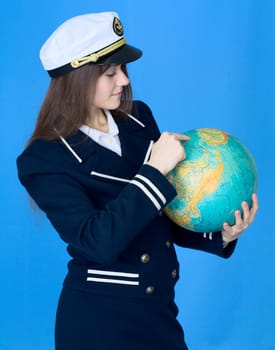 Woman in sea uniform and terrestrial globe