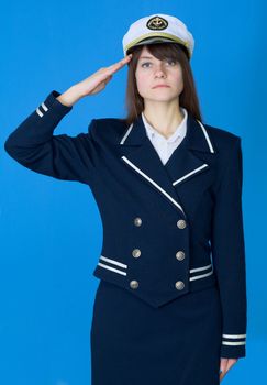 The girl in a sea uniform salutes