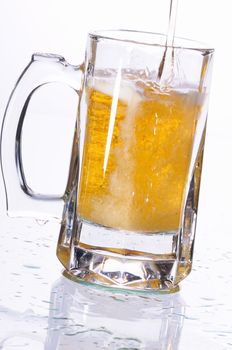 Mug with beer poured on a table