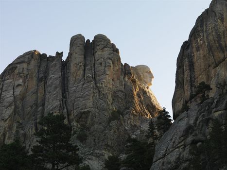 View of George Washington profile on mountain cliffside of Mount Rushmore National Memorial.