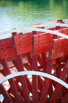 Close-up of red paddlewheel of riverboat in Sacramento, California, USA.