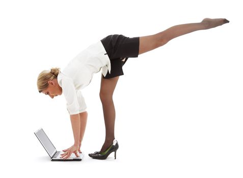 flexible businesswoman with laptop computer over white