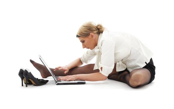 flexible businesswoman with laptop computer over white