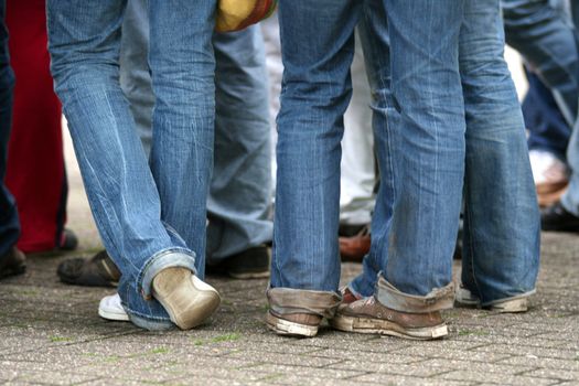 Teenagers legs with blue jeans