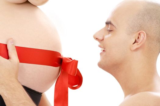 picture of happy man holding belly of pregnant woman