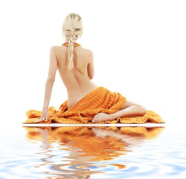 picture of beautiful lady with orange towels on white sand