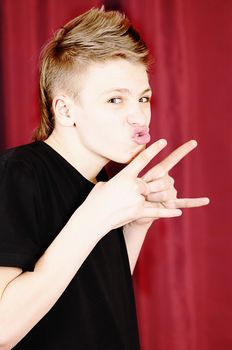 The teenager in a black vest  isolated on white background