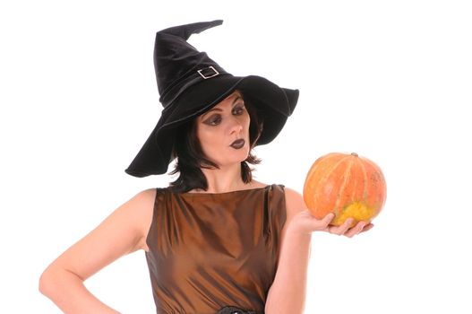 Young witch with pumpkin  isolated on white background