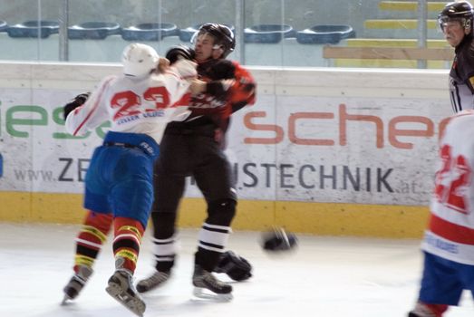 ZELL AM SEE, AUSTRIA - 27 MARCH. Benedikt Hahn fighting Kontschieder at the game between Salzburg Devils and SV Schuettdorf (3-12) on March 27 2010 in Zell am See.