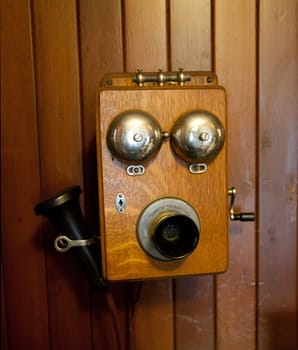 Olf fashioned wooden telephone set with separate handset and bells