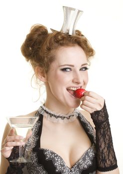 Smiling girl with strawberry and glass of vermuth