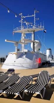 Cruise ship upper deck and super-structure with lounge chairs