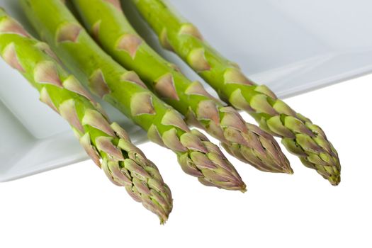 detail of fresh green asparagus isolated on white background