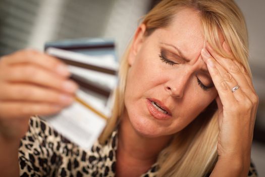 Very Upset Woman Holding Her Many Credit Cards.