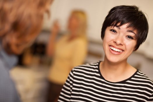 Laughing Young Woman Socializing in a Party Setting.