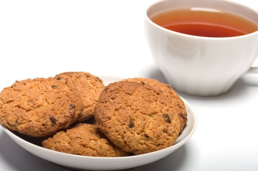 Cup of tea and cookies a close up