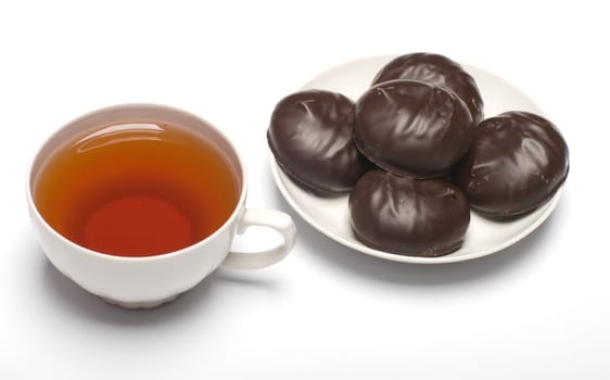 Cup of tea and marshmallow on a saucer