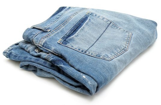 A pair of blue denim jeans on white background.