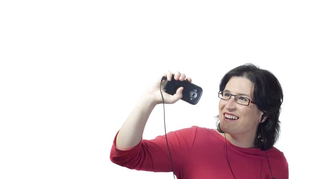 young woman listening, dancing and singing to music in a mp3 device