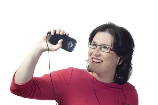 young woman listening, dancing and singing to music in a mp3 device