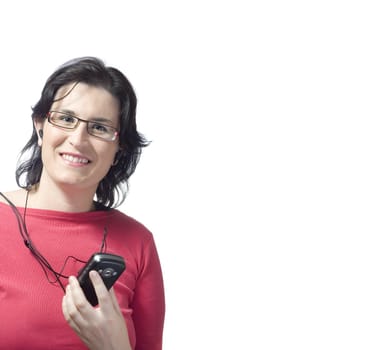 young woman listening, dancing and singing to music in a mp3 device