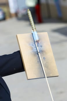 a man launching fireworks rockets with his hands