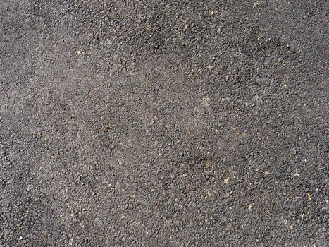 Dark asphalt texture closeup