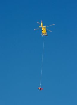 Mountain rescue helicopter in action